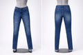 Blue jeans on a mannequin against a white background