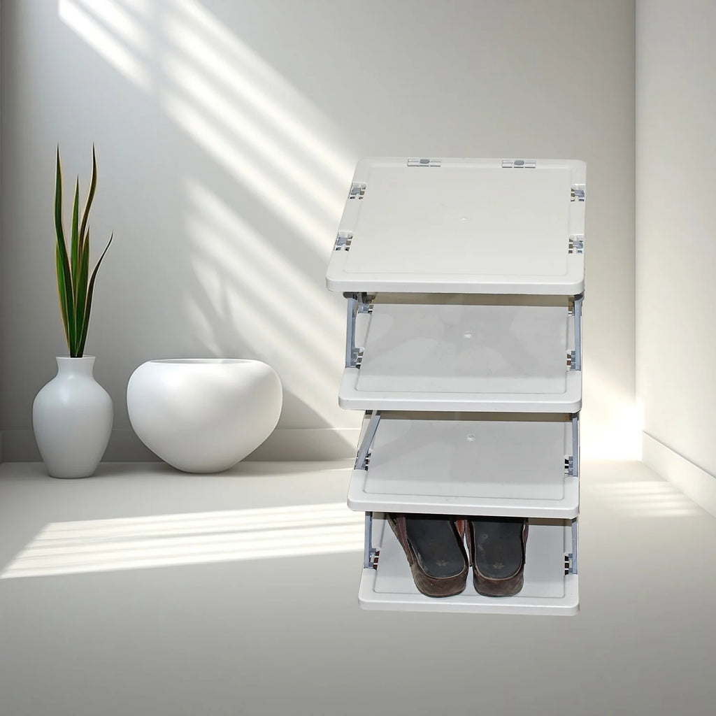 White folding step ladder with shoes underneath on a light gray floor.