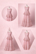 Pink floral dress displayed on a mannequin against a pink background