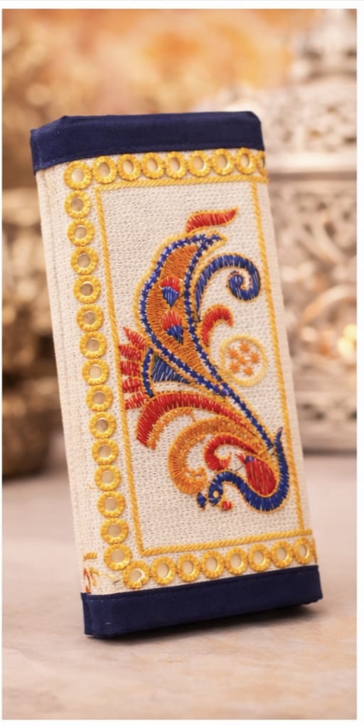 Decorative phone case with intricate patterns on a blurred background